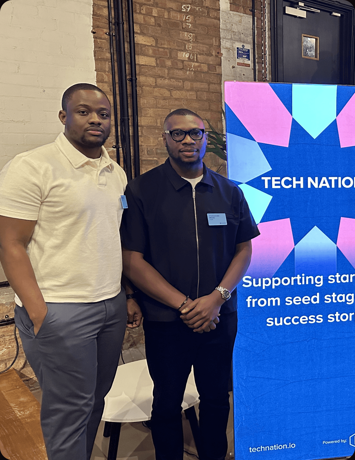 A group of founders standing beside a Tech Nation banner reading “Supporting startups from seed stage to success story”